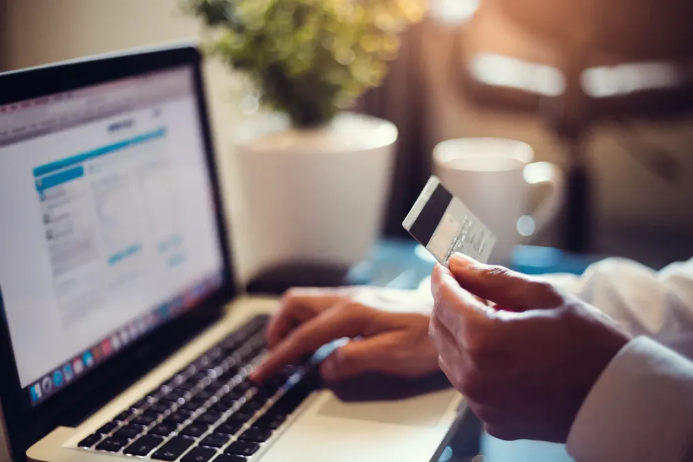 online purchase on laptop with travel card